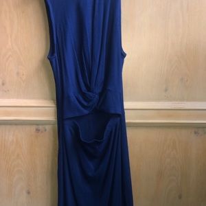 Tight fitting blue dress with slit
